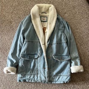 Long denim jacket with Sherpa lining.